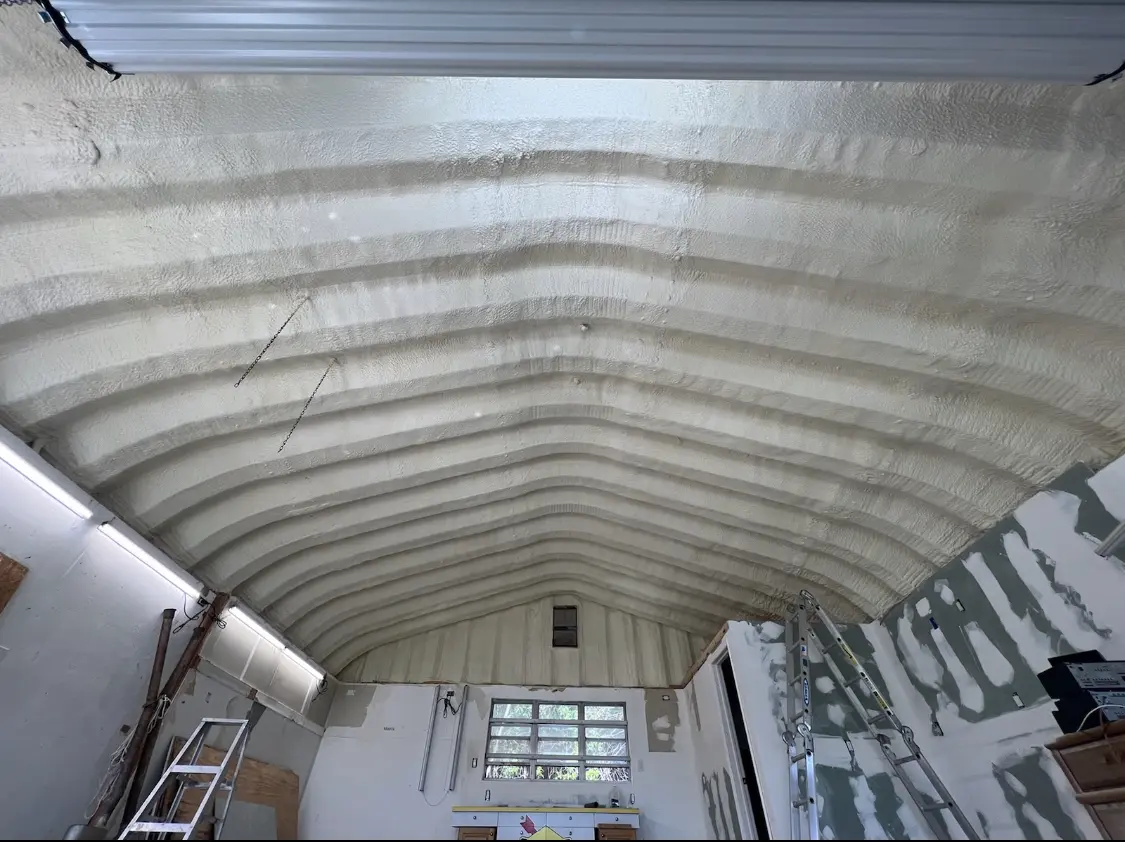 Spray polyurethane foam applied to the underside of a metal roof deck in Pawtucket